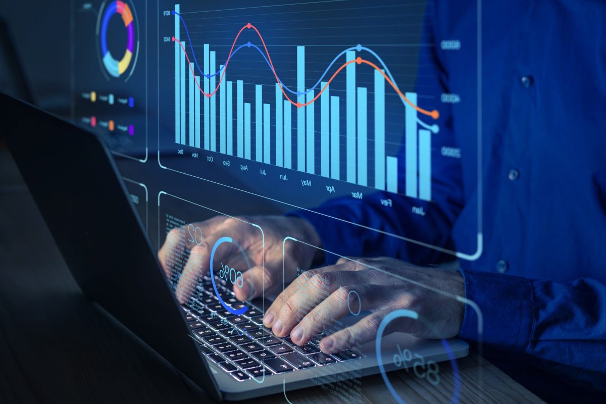 Data analyst working on business analytics dashboard with charts, metrics and KPI to analyze performance and create insight reports for operations management.